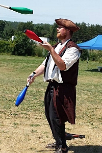 A juggling Drick Brother entertains in the streets at The Ontario Pirate Festival